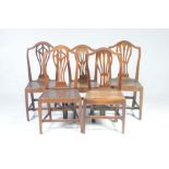 A matched set of five 19th Century country Chippendale style oak dining chairs Each with a pierced