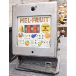 A vintage Melroy automatics "Mel-Fuit" penny slot machine With a chromed metal hinged front,