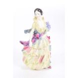 A Royal Doulton figurine entitled "Pamela", HN1469 Figurine holding flowers, height 20cm.