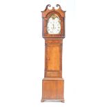 A late 18th early 19th Century oak and mahogany crossbanded longcase clock Having a 12" painted