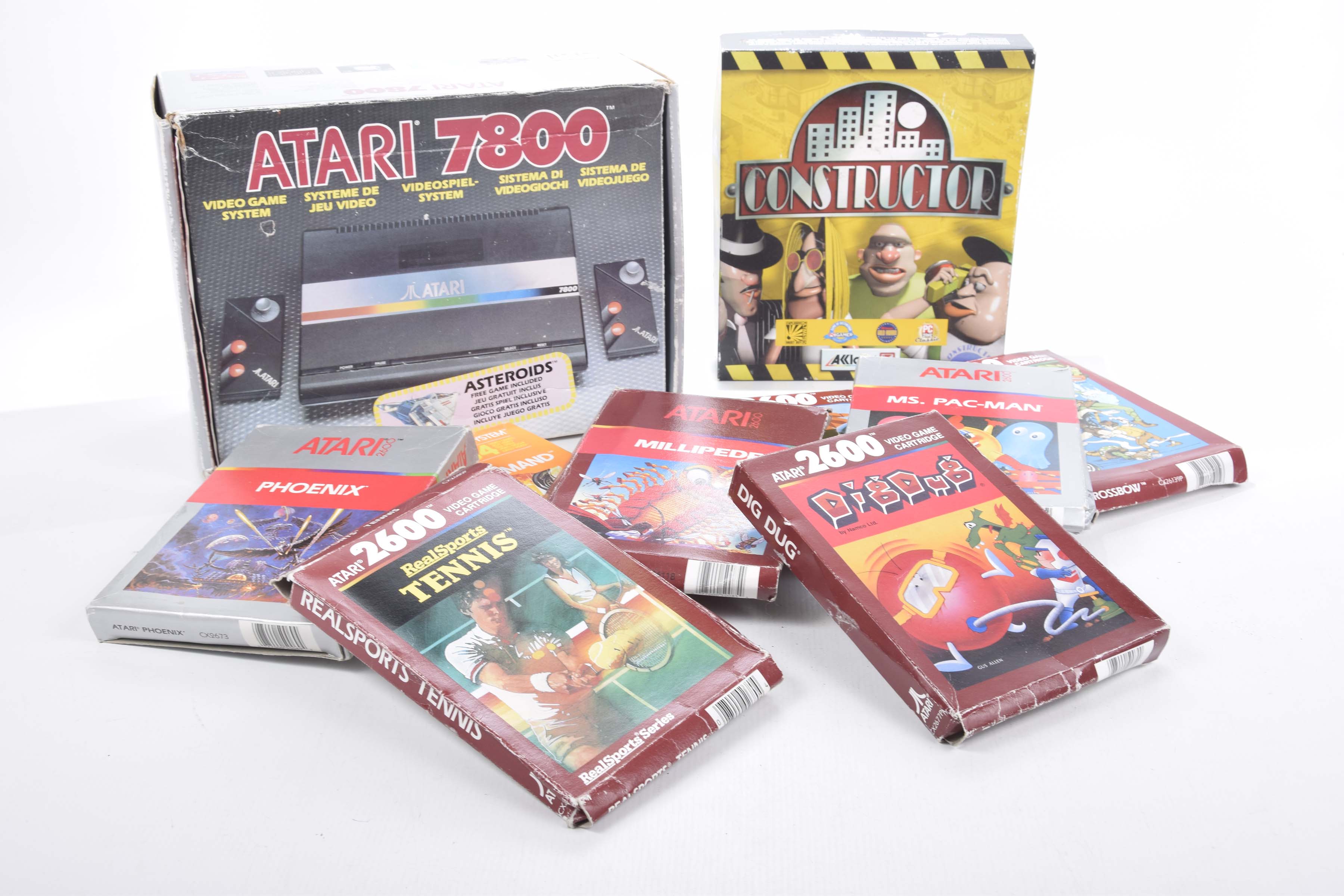 A boxed Atari 7800 video game Box containing game machine, two pads and instruction book,