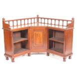 An unusual late Victorian ecclesiastical freestanding walnut corner bookcase The top with a turned