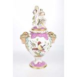 An ornate continental vase and cover,