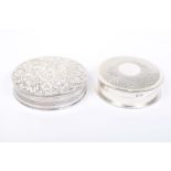 Two silver circular boxes Each of differing design, with engraved and engine turned decoration,