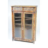 A late 19th early 20th Century bamboo glazed cabinet The rectangular top covered in embossed paper