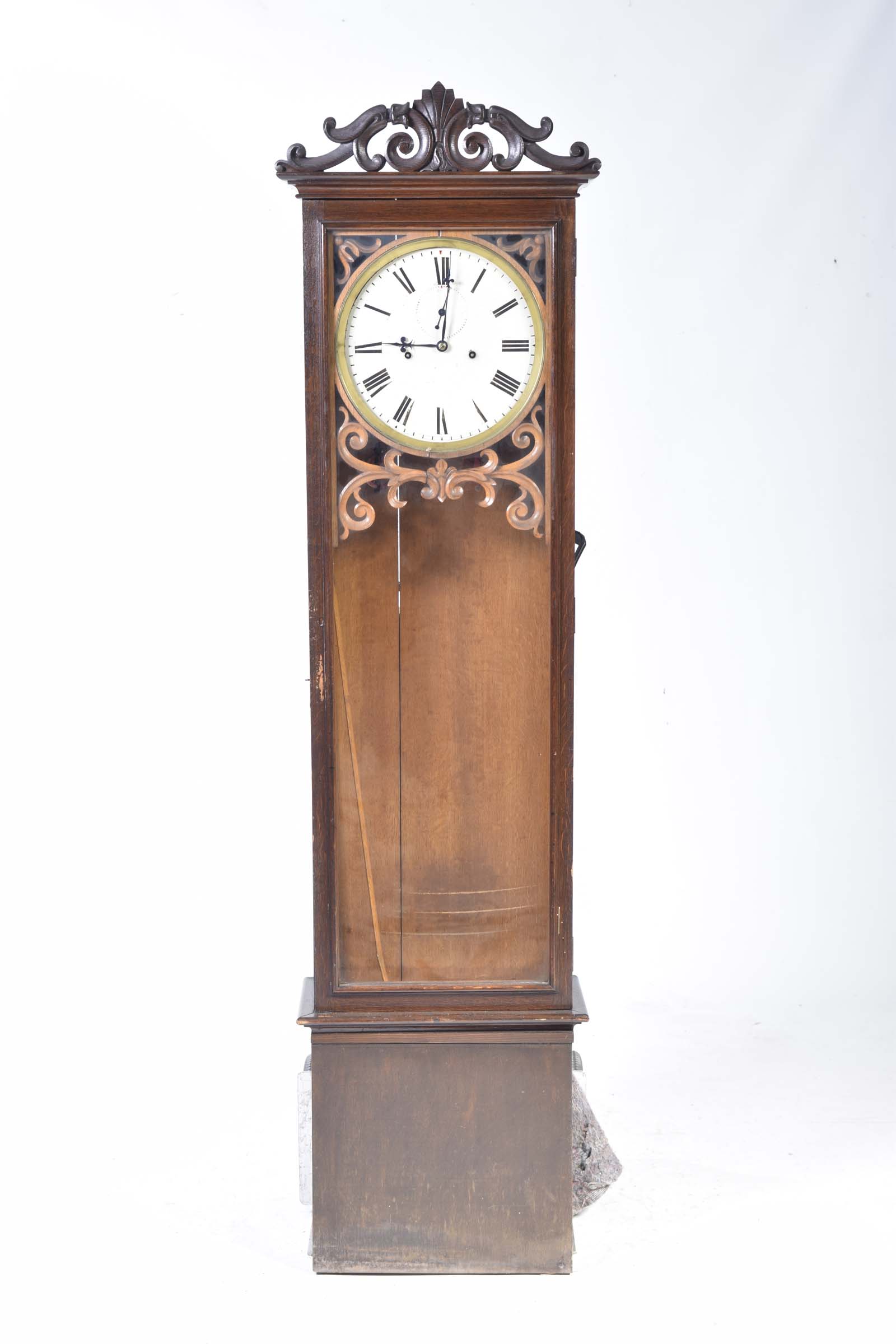 A 19th Century oak cased longcase clock Having a scrolling foliate and shell crest above a 12"