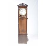 A 19th Century oak cased longcase clock Having a scrolling foliate and shell crest above a 12"