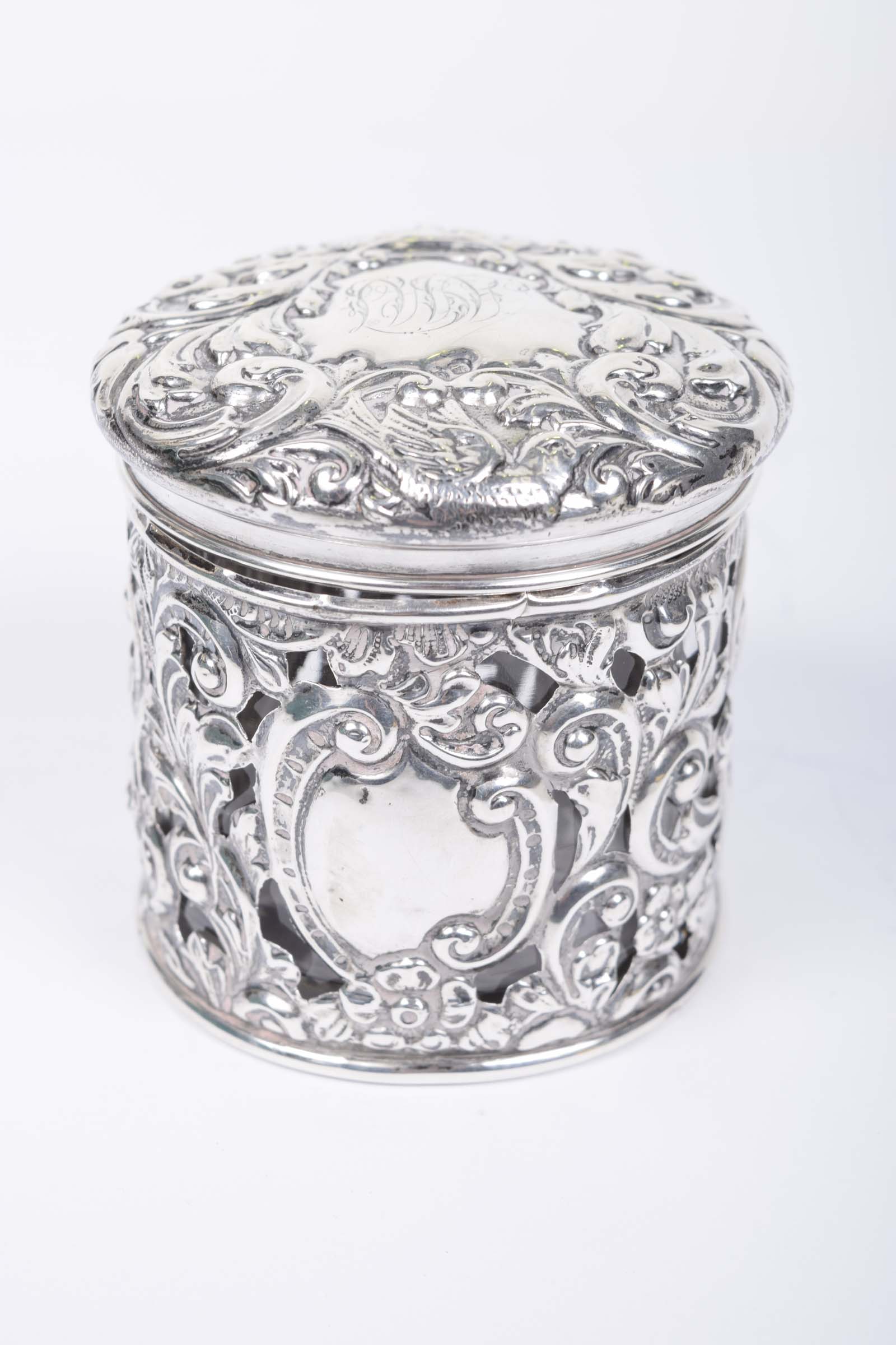 A Victorian silver and glass lidded canister Of cylindrical form,