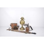 A Victorian oil lamp and three other collector items The oil lamp with an etched glass shade,