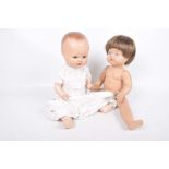 Two composition jointed dolls The first stamped Germany with cross wheatsheaves along with a second