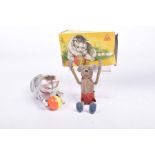A Schuco felt clockwork acrobatic mouse with key Wearing red shorts and blue shoes,