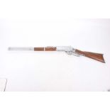 A copy of a Winchester rifle, 20th century The toy rifle with 51cm barrel, wooden stocked.