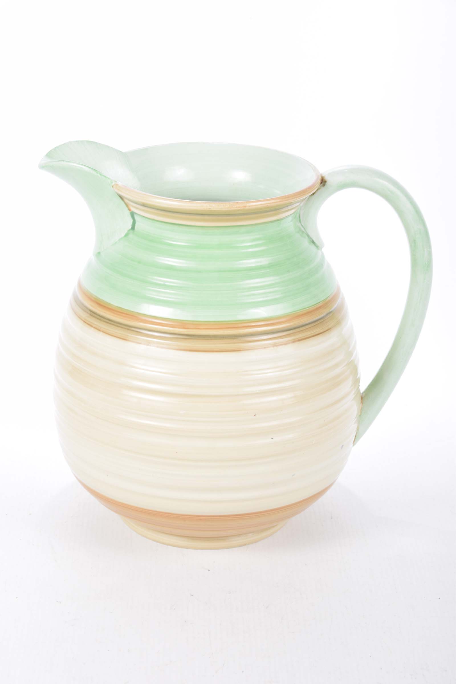 A Shelley green and brown Colourway jug With ribbed decoration, height 21cm.