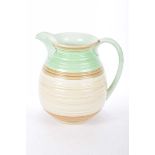 A Shelley green and brown Colourway jug With ribbed decoration, height 21cm.