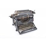 An early 20th Century Underwood American typewriter Painted black with circular letter keys.