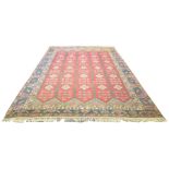 A good quality Caucasian rug on a mainly red ground,