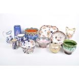 A collection of decorative ceramics Twelve items to include a Crown pottery cylindrical vase,