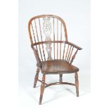 An 18th / 19th Century elm and yew Windsor farmhouse elbow chair The arched stick back with a