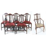 A set of five 19th Century Hepplewhite style dining chairs Each with an arched back and pierced