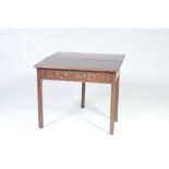 A George III mahogany folding tea table With a rectangular moulded top above a single frieze drawer