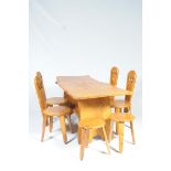 A rustic elm slab top kitchen table with four conforming chairs and stools by Daffodil Dell The