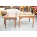 An early 20th Century oak extending dining table and a second similar table With a rectangular