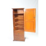 An early 20th Century mahogany hall cupboard With a single door enclosing a shelf and racks,