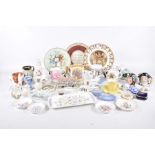 A quantity of decorative ceramics To include a Staffordshire style cottage,
