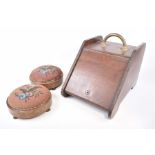 A pair of circular walnut veneered footstools with beaded tops,