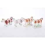 Four Staffordshire cow creamers, late 19th,