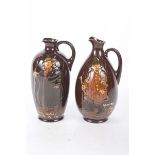 Two Royal Doulton Dewar's Whisky Kingsware jugs,