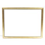 A large modern gilt framed rectangular wall mirror The bevelled plate within a beaded border,