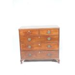 An early 19th Century mahogany chest of drawers The rectangular moulded top above two short,