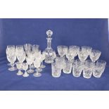 A tray of cut glassware To include a bulbous cut glass decanter with star cut base,