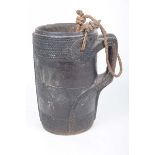 A late 19th early 20th Century primitive hardwood water pale With a rope swing handle carved loop