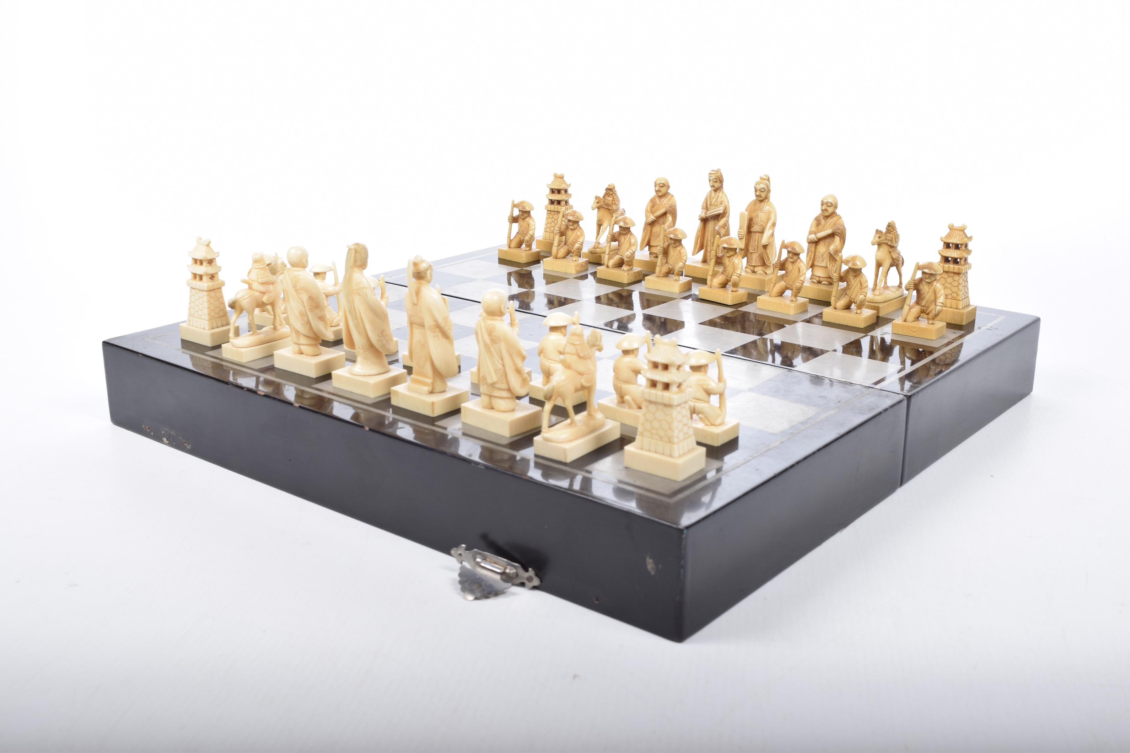 A Japanese carved ivory chess set, Circa 1936 Comprising thirty-two individual pieces,