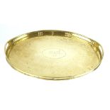 An Arts & Crafts Newlyn brass tray Of oval form,