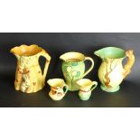 Five Burleigh ware jugs To include Squirrel handle example, height 19.