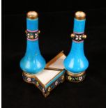 A pair of Minton turquoise glazed vases in the manner of Dr.