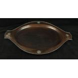 A fine Arts & Crafts A E Jones copper tray Of oval form with two handles,