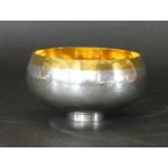 A fine Stuart Devlin hallmarked silver and gilt bowl Having planished decoration to body,