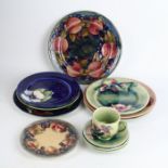 Thirteen pieces of Walter Moorcroft pottery To include circular plate decorated in the