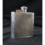 An Art Deco hallmarked silver hip flask Having engine turned decoration,