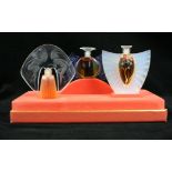 A boxed set of three Lalique 'Les Flacons' miniature perfume bottles Each containing perfume