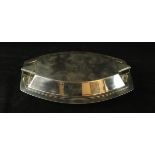 An Art Deco silver-plated entree dish and cover Having two angular handles,