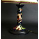 A modern Moorcroft candlestick table lamp Decorated in the 'Queens Choice' pattern,