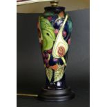 A modern Moorcroft pottery table lamp Decorated in the 'Queens Choice' pattern,