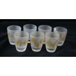 Seven French Art Deco shot glasses Each having mottled amber streaked decoration on a frosted