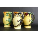 Three Burleigh ware jugs Each decorated with Dragon handles, each with printed marks to base,