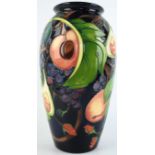 A large modern Moorcroft vase of cylindrical form Decorated in the 'Queens Choice' pattern,